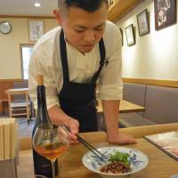 Natural pairing: Kouki Watanabe serves yodaretori with a glass of natural wine. | J.J. O\'DONOGHUE