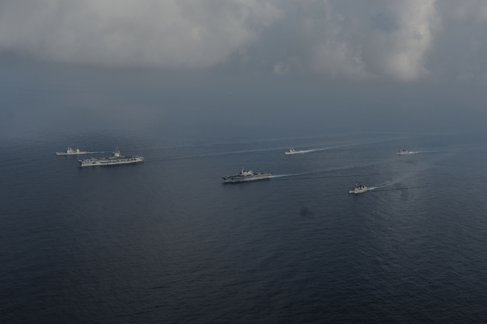 The Maritime Self-Defense Force helicopter carrier Kaga and destroyers Inazuma and Suzutsuki sail with the USS Ronald Reagan aircraft carrier and two other U.S. warships in the South China Sea on Aug. 31. | U.S. NAVY