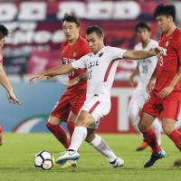 The Antlers\'  Serginho, who scored Kashima\'s opening goal in the 14th minute, controls the ball against Tianjin Quanjian in an Asian Champions League quarterfinal, second-leg match on Tuesday in Macau. Kashima won 3-O. KYODO | MIYAGI PREFECTURAL POLICE / VIA KYODO