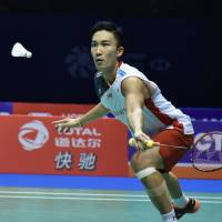 Kento Momota competes against Indonesia\'s Anthony Sinisuka Ginting in the China Open men\'s singles final on Sunday. | KYODO