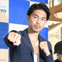Kazuto Ioka poses during a news conference on July 20 in Tokyo. | KYODO