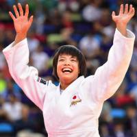 Uta Abe celebrates after winning the gold medal in the women\'s under-52 kg category at the World Judo Championships in Baku on Friday. | KYODO