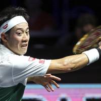 Kei Nishikori hits a return to Nikoloz Basilashvili in the Moselle Open quarterfinals on Friday in Metz, France. Nishikori won 6-3, 4-6, 6-4. | KYODO