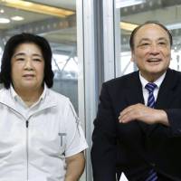 Chieko Tsukahara (left) and husband Mitsuo pose before an interview. The two, who were suspended from senior positions at the Japan Gymnastics Association on Monday, have denied allegations that they harassed Olympic gymnast Sae Miyakawa. | KYODO