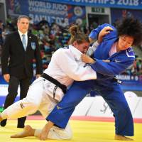 Shori Hamada (right) competes against Guusje Steenhuis during the women\'s 78-kg final at the judo world championships on Tuesday in Baku. | AFP-JIJI