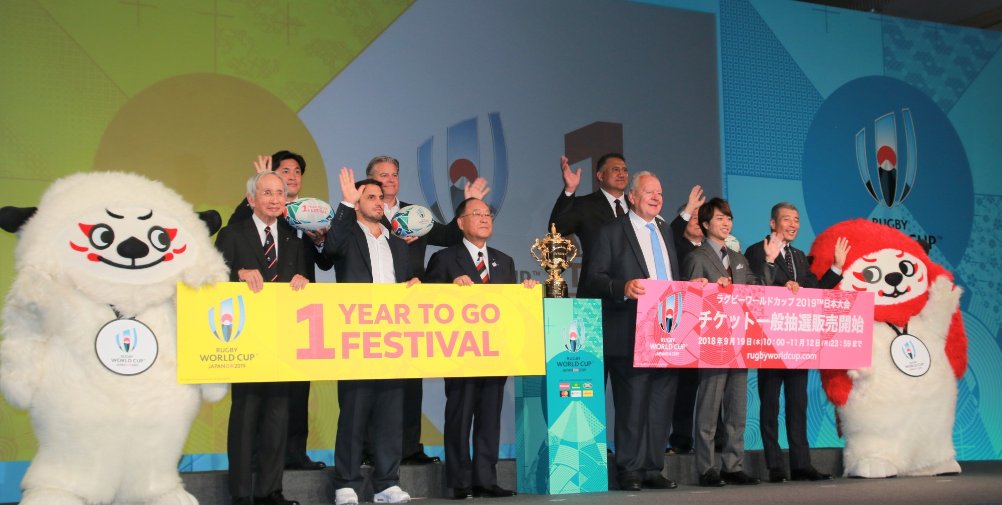 Rugby World Cup officials pose for photos at Meiji Kinenkan on Thursday. | KAZ NAGATSUKA