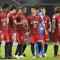 Kashima Antlers players gather after their 1-1 draw against Kawasaki Frontale in the first leg of the Levain Cup quarterfinals at Kashima Stadium on Wednesday night. | KYODO