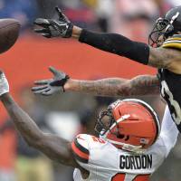 Cleveland Browns wide receiver Josh Gordon, bottom, cannot hold onto the ball under pressure from Pittsburgh Steelers defensive back Joe Haden during the second half of their NFL season opener on Sunday in Cleveland | AP