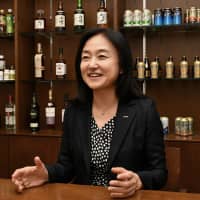 Suntory Holdings Ltd. Executive Officer Tomomi Fukumoto explains the firm\'s environmental efforts in an interview with The Japan Times in Tokyo on Sept. 11. | YOSHIAKI MIURA