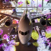 The first Boeing Co. 787 jetliner is seen at the Flight of Dreams commercial complex at Chubu Centrair International Airport in Nagoya on Friday. | KYODO