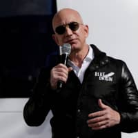 Amazon and Blue Origin founder Jeff Bezos addresses the media about the New Shepard rocket booster and Crew Capsule mockup at the 33rd Space Symposium in Colorado Springs, Colorado, last year. | REUTERS