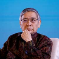 Bank of Japan Gov. Haruhiko Kuroda attends a seminar at the International Monetary Fund and World Bank Group annual meeting, in Nusa Dua, on the Indonesian island of Bali, on Saturday. | REUTERS
