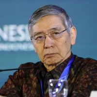 Bank of Japan Gov. Haruhiko Kuroda speaks during a forum at the International Monetary Fund and World Bank annual meetings in Nusa Dua, on Indonesia\'s resort island of Bali, on Sunday. | AFP-JIJI