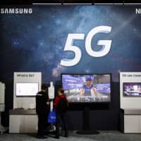Samsung Electronics Co. touts fifth-generation mobile communications at the Mobile World Congress Americas event in Los Angeles in September. Sources say NEC Corp. will tie up with the South Korean firm on developing 5G solutions. | BLOOMBERG