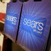 Sears gift cards are displayed at a store in Hackensack, New Jersey, Monday. Sears filed for Chapter 11 bankruptcy protection Monday, buckling under its massive debt load and staggering losses. | AP