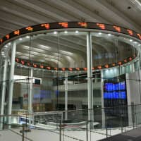 An electronic ticker displays share prices at the Tokyo Stock Exchange in the capital in July. | BLOOMBERG