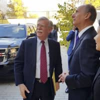 U.S. National Security Adviser John Bolton (left) and Russian Security Council chairman Nikolai Patrushev talk prior their official talks in Moscow Monday. | PRESS SERVICE OF THE RUSSIAN SECURITY COUNCIL / VIA AP