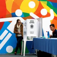 Brazilians cast their votes in the nation\'s presidential election in Curitiba on Sunday. | REUTERS