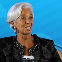 International Monetary Fund Managing Director Christine Lagarde speaks during the closing ceremony for the IMF/World Bank annual meetings in Nusa Dua on the Indonesian resort island of Bali on Sunday. | AFP-JIJI