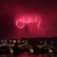 Fireworks mark the 100th anniversary of the creation of the independent Czechoslovak state, above the Charles Bridge on Sunday in Prague. | AFP-JIJI