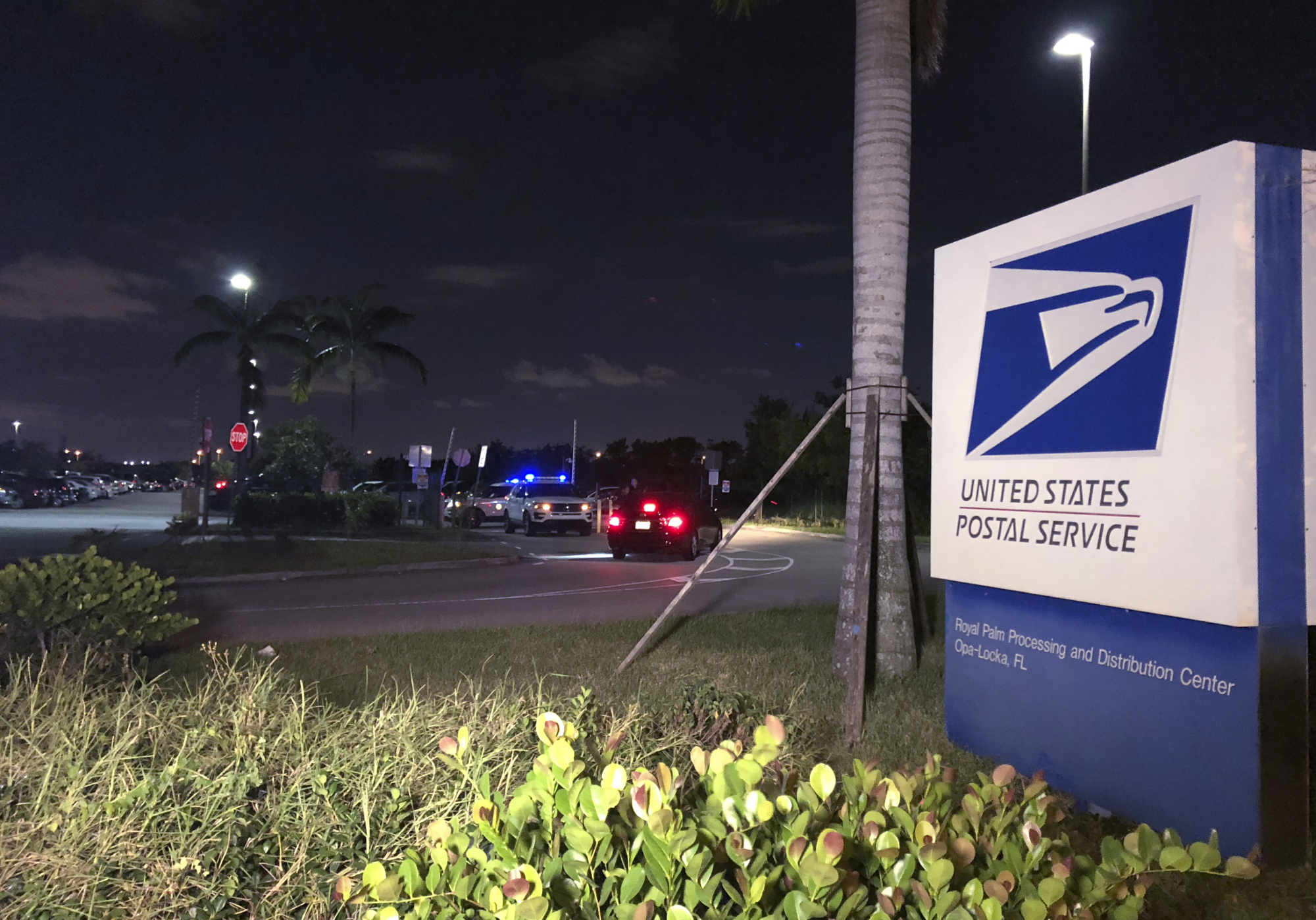 Postal service police screen employees entering the Royal Palm processing and Distribution Center, Thursday in Opa-locka, Florida. A law enforcement source tells The Associated Press that Miami-Dade police have gone to the mail-sorting facility in Opa-Locka at the request of the FBI in connection with the suspicious package investigation. The source says it was a precautionary measure. | AP