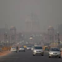 President House is seen through smog in New Delhi on Thursday. Levels spike during the winter in northern India, when air quality often eclipses the World Health Organization\'s safe levels. | AFP-JIJI