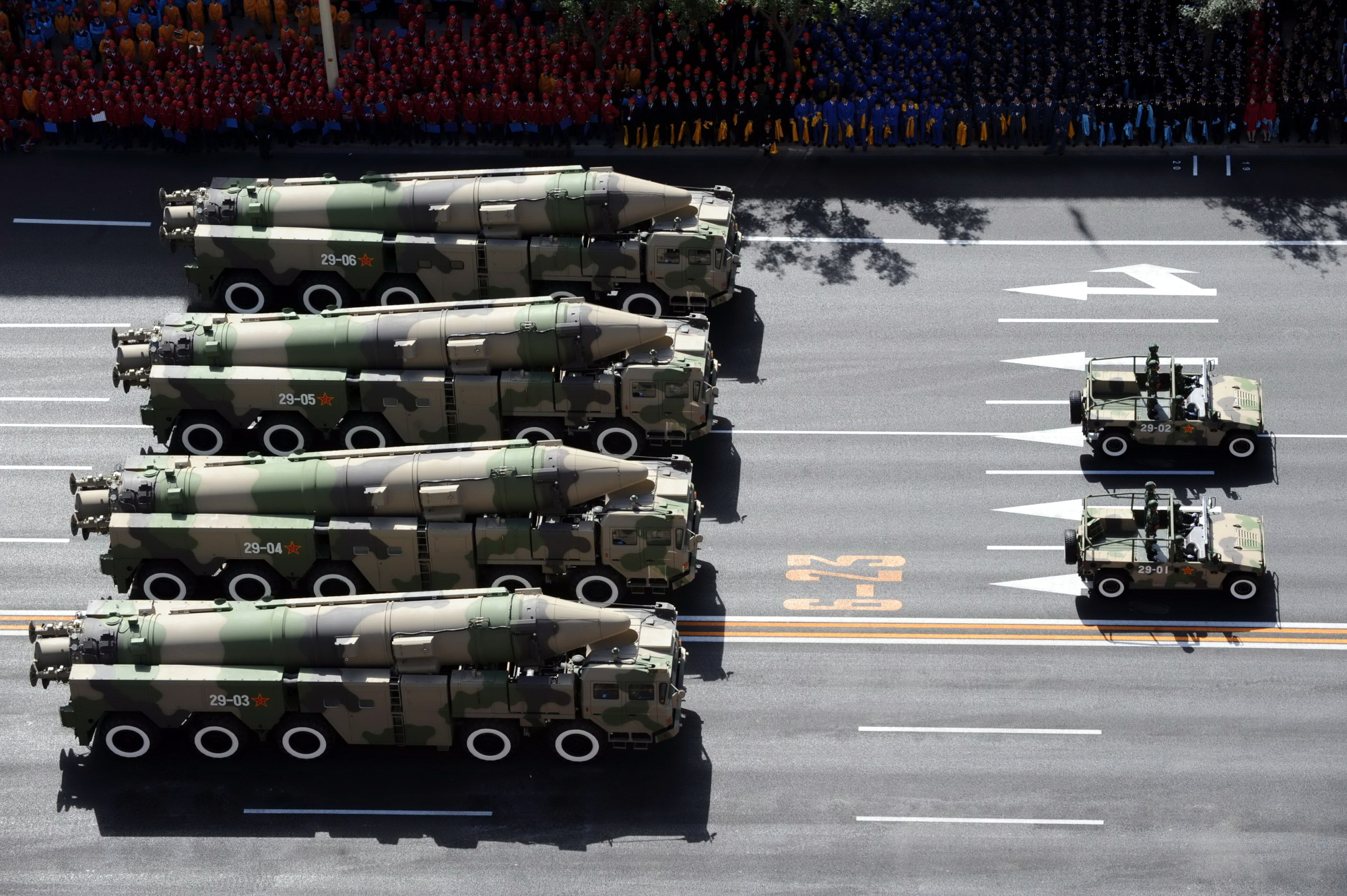 Chinese military vehicles carrying DF-21C medium-range ballistic missiles parade through Beijing's Tiananmen Square during a military parade marking the 60th anniversary of the founding of the Peoples Republic of China in October 2009. | IMAGINECHINA / VIA AP