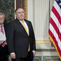 John Bolton (left), national security advisor, nd Mike Pompeo, U.S. secretary of state, attend an Interagency Task Force to Monitor and Combat Trafficking in Persons annual meeting in the Indian Treaty Room of the Eisenhower Executive Office Building in Washington on Oct. 11. | BLOOMBERG