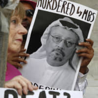 A protest is held Wednesday outside the Saudi Arabian Embassy in Washington over the disappearance of Saudi journalist Jamal Khashoggi. | AP
