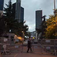 A man passes through metal security barriers as he enters the Saudi Arabian Consulate in Istanbul on Saturday. The Trump administration is weighing its response following the disappearance of Saudi Arabian journalist Jamal Khashoggi, who was also a U.S. resident. | AP