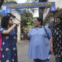 Former TV producer, director and writer Vinta Nanda (third from left) walks with friends outside a police station after filing a complaint against actor Alok Nath in Mumbai on Wednesday. Nanda said on Facebook and in TV interviews that Nath raped her 19 years ago. | AP