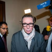 Jean-Claude Arnault, a French national, arrives at the district court in Stockholm on Sept. 19. | AFP-JIJI