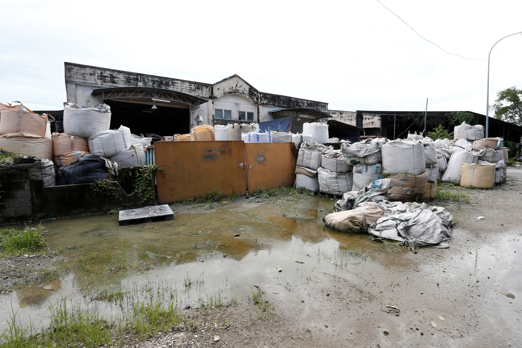 An illegal plastic recycling factory in Pulau Indah, Malaysia, is pictured on Oct. 14. | REUTERS