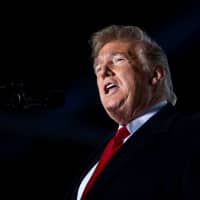 U.S. President Donald Trump speaks during a campaign rally at Southern Illinois Airport in Murphysboro, Illinois, Saturday. | REUTERS