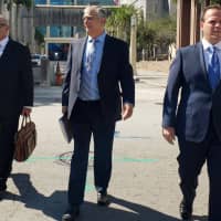 Attorneys (from left) Jamie Benjamin, Daniel Aaronson and Peter Patanzo, representing Cesar Sayoc, who\'s accused of mailing pipe bombs to prominent critics of U.S. President Donald Trump, walk outside the Federal Court building in Miami Monday. | REUTERS