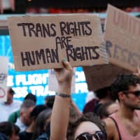 People protest U.S. President Donald Trump\'s announcement that he plans to reinstate a ban on transgender individuals from serving in any capacity in the U.S. military, in Times Square in New York City last year. | REUTERS