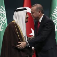 Turkish President Recep Tayyip Erdogan (right) and Saudi Arabia\'s King Salman embrace each other during a medal ceremony in Ankara in 2016. The disappearance of journalist Jamal Khashoggi from the Saudi Consulate in Istanbul is just the latest crisis to strain relations between the kingdom and Turkey in the wake of the 2011 Arab Spring. | AP