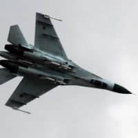 A Ukrainian air force Su-27 fighter jet is in the sky outside Slovyansk, 160 km (100 miles) from the Russian border, in eastern Ukraine in 2014. Ukraine\'s military says that a Ukrainian fighter jet taking part in a joint U.S.-Ukrainian air force exercise has crashed, killing both pilots. The General Staff of Ukraine\'s armed forces said the two-seat Su-27UB went down Tuesday in the Kmelnitskyi region. | AP