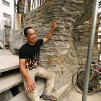 Keisuke Oka, a 53-year-old architect, has been working on the Arimaston Building in Tokyo\'s Minato Ward for the past 13 years, mostly on his own. | YOSHIAKI MIURA