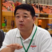Naoki Kurano, a board member of the Japanese Federation of the Deaf, explains the significance of bringing the Deaflympics to Japan using sign language on Sept. 23 in Fukaya, Saitama Prefecture. | YOSHIAKI MIURA