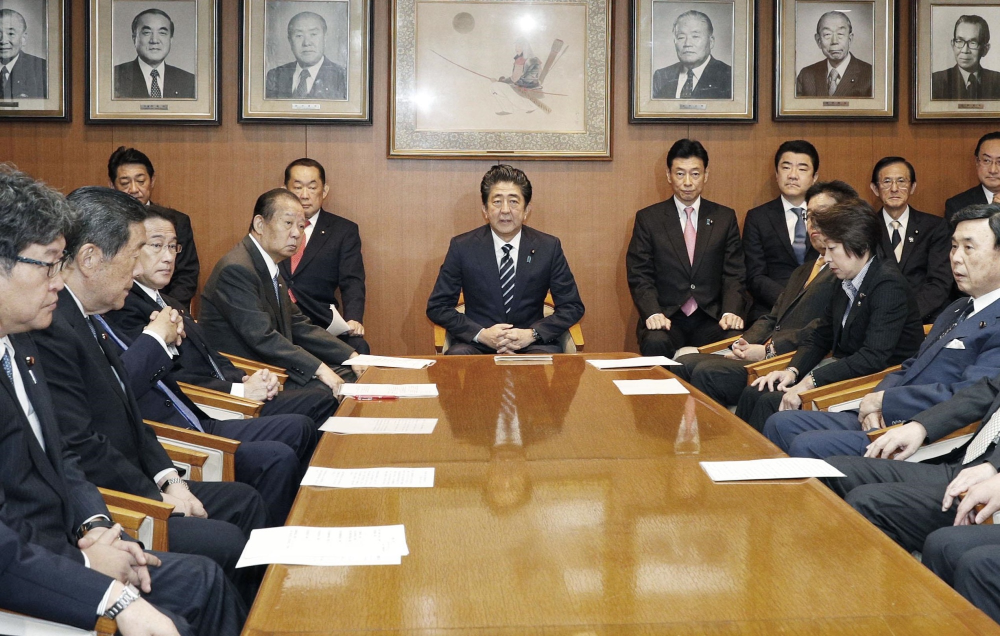 Prime Minister Shinzo Abe meets with executives of his ruling Liberal Democratic Party on Tuesday at the party's head office in Tokyo. An extraordinary Diet session, which continues until Dec. 10, opens Wednesday. | KYODO