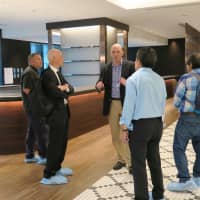 Marcus Fishenden (center), general manager of the Foreign Correspondents\' Club of Japan, discusses the press club\'s new home in the Marunouchi Nijubashi Building in Tokyo on Oct. 12, ahead of its formal relocation on Oct. 29. | KYODO