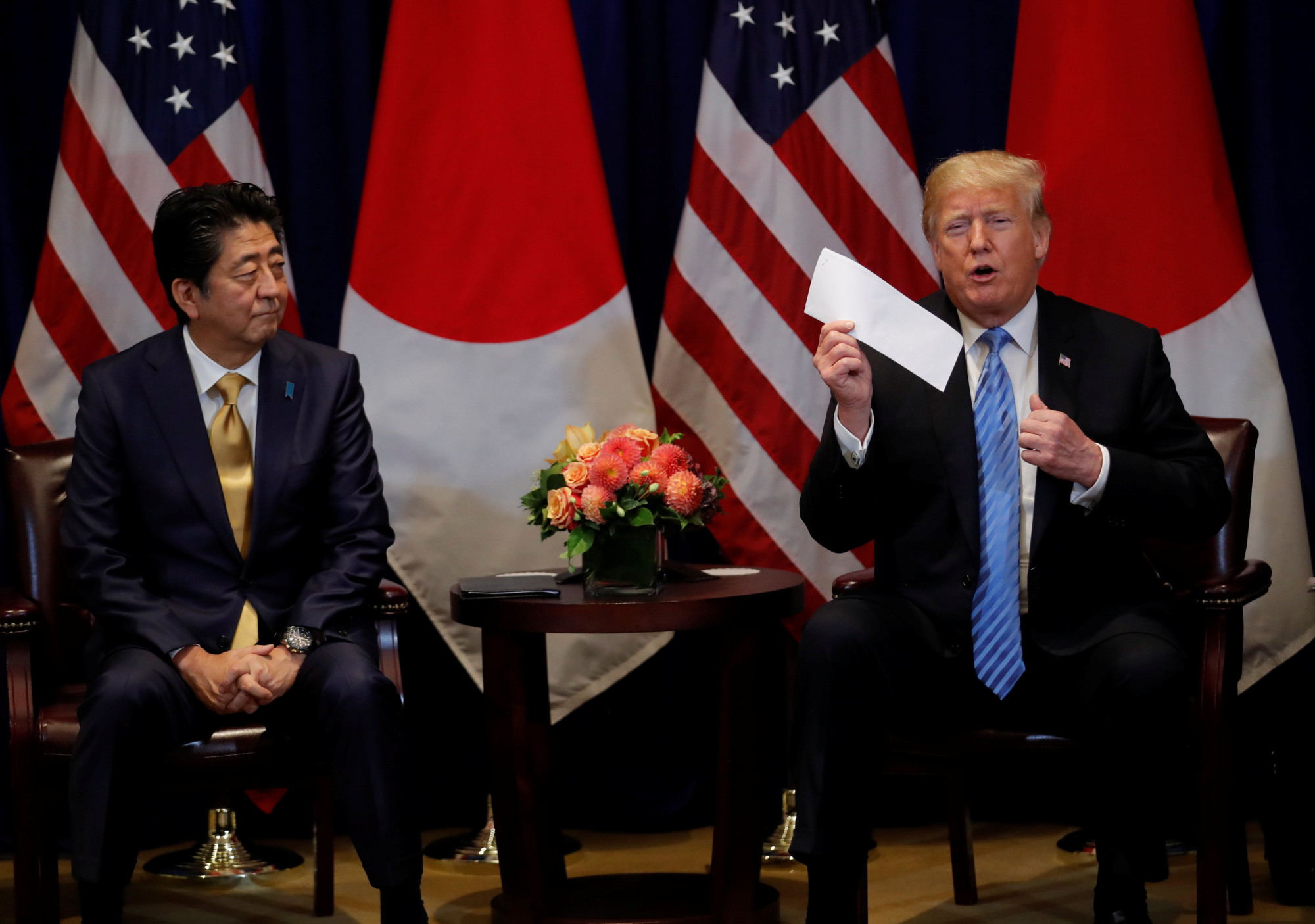 U.S. President Donald Trump shows a letter he said he received from North Korean leader Kim Jong Un, during a bilateral meeting with Prime Minister Shinzo Abe on the sidelines of the 73rd session of the United Nations General Assembly in New York on Sept. 26. | REUTERS