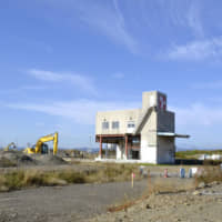 A marine product processing factory that withstood the March 2011 tsunami is seen in Natori, Miyagi Prefecture, on Friday. | KYODO