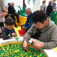 Junya Suzuki and his son enjoy a day at Legoland in Billund, Denmark. | THRONE © KOHEI NAWA | SANDWICH INC.