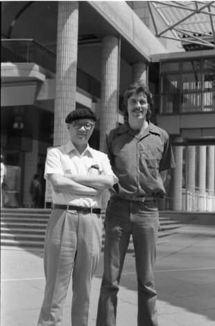 Frederik L. Schodt (right) poses for a photo alongside manga artist Osamu Tezuka.