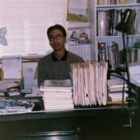 Seiji Horibuchi sits at a desk in the offices of his startup manga and anime distributor, Viz Communications, in 1985. | COURTESY OF SEIJI HORIBUCHI