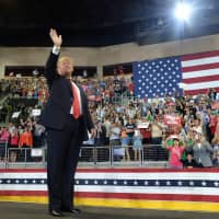 U.S. President Donald Trump greets supporters at a campaign rally in Erie, Pennsylvania, on Wednesday. | AP