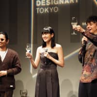 Creative director Kunichi Nomura, Amazon Fashion Week Tokyo Official Advisor Kiko Arai and Designart ambassador Harry Sugiyama raise a toast at the opening ceremony of Designart Tokyo 2018 at Omotesando Hills on Friday . | MARK THOMPSON