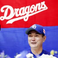 Dragons reliever Hitoki Iwase speaks at a news conference on Tuesday at Nagoya Dome. | KYODO